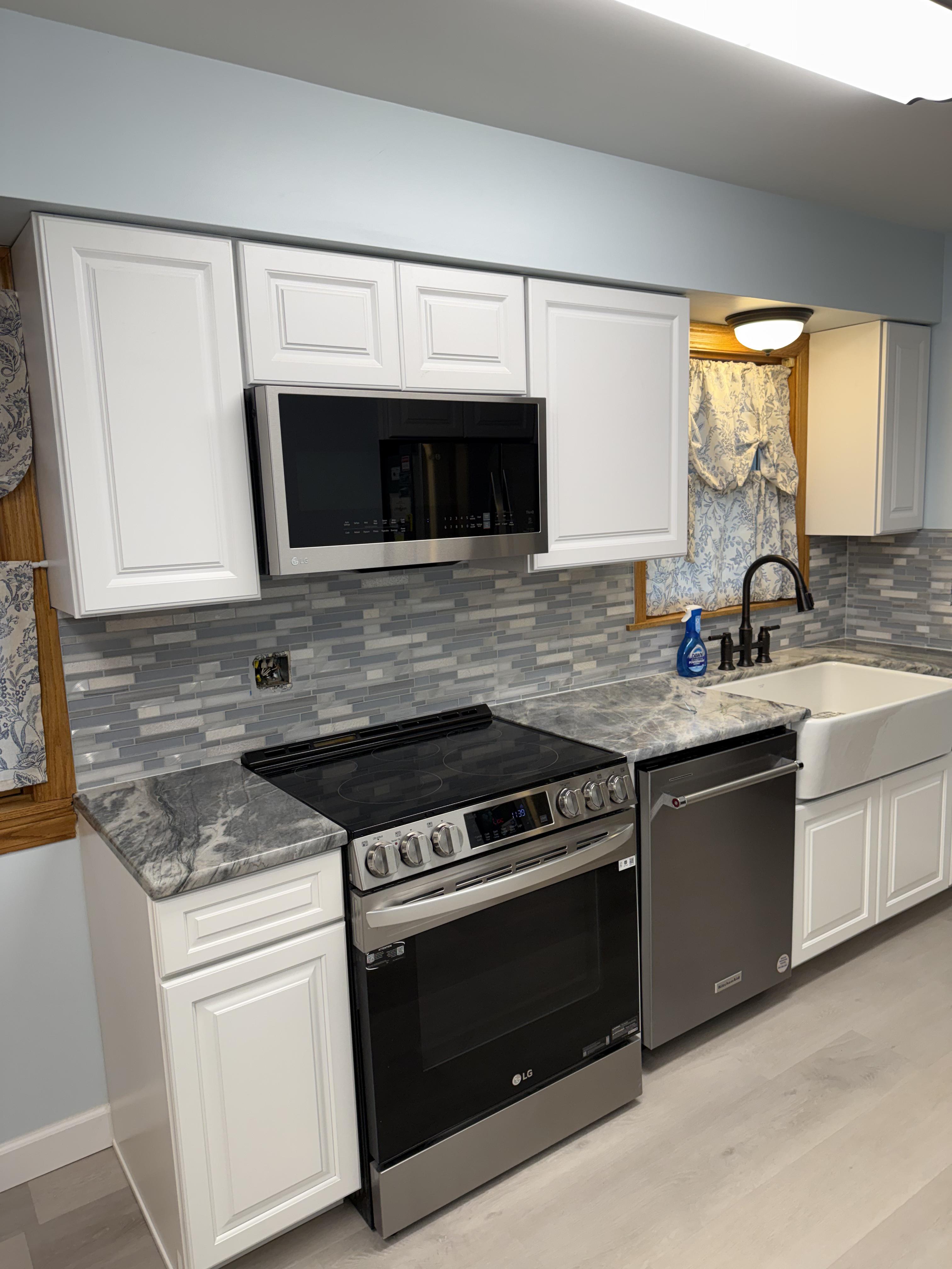 Modern white shaker kitchen cabinets and custom countertops